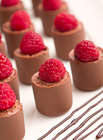 Chocolate Dessert Recipe of chocolate mini-cups with respeberries on a white plate