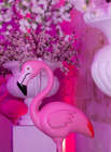Tea Party Decorations with Pink flamingo bird cherry blossom flowers and white garden vases on a pink background