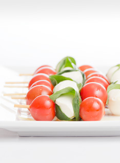 Finger Food Recipe of Bocconcini Tomatoes Skewers on a white plate